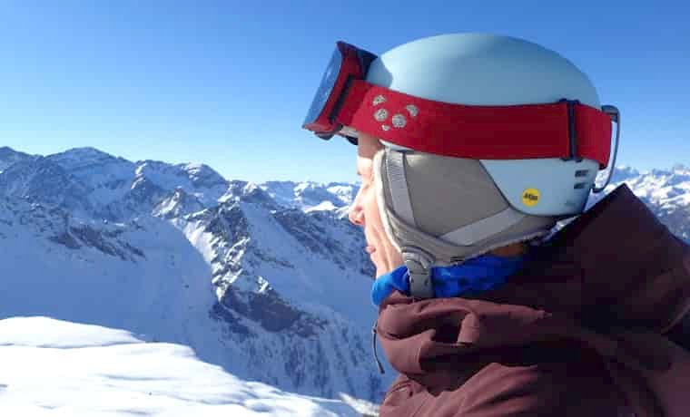 Woman wearing helmet in the mountains