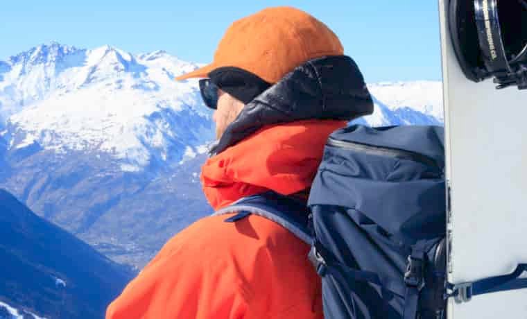 Man looking out over mountains