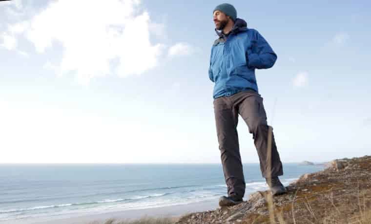Man standing looking out to sea