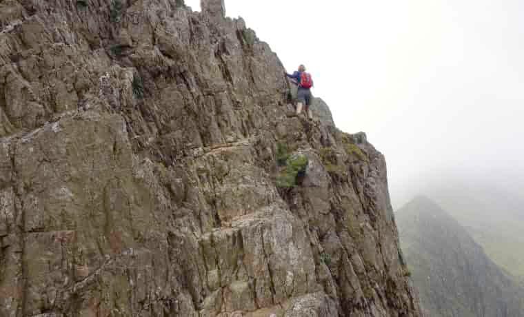 Woman rock scrambling