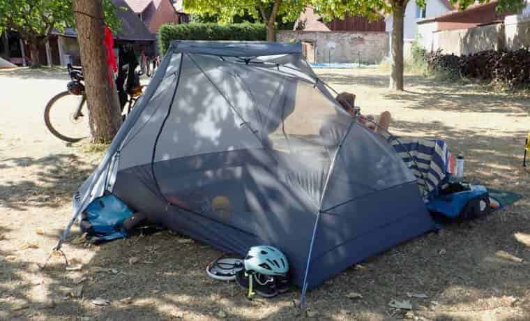 Man sitting next to tent