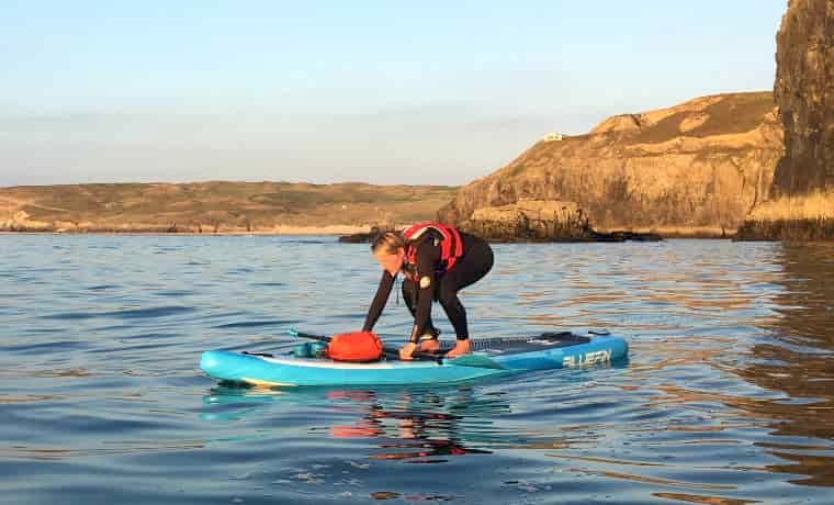 Standing up on a paddle board