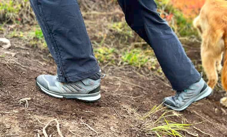 Hiking up a steep track in boots