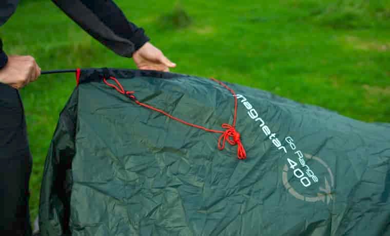 Person putting up tent