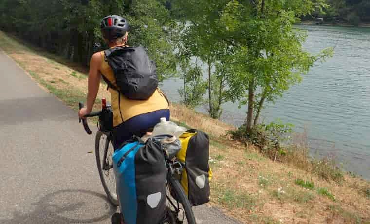 Woman cycling with backpack