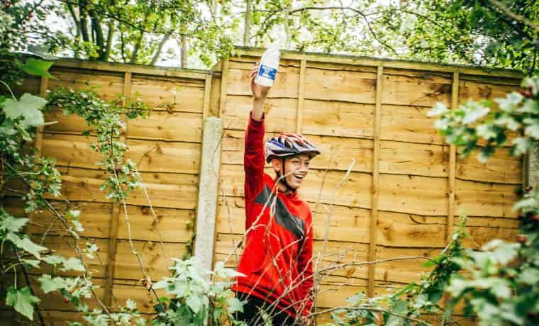 Cyclist picking up litter