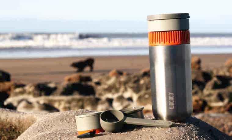 Wacaco Pipmoka Coffee Mug and maker on the beach