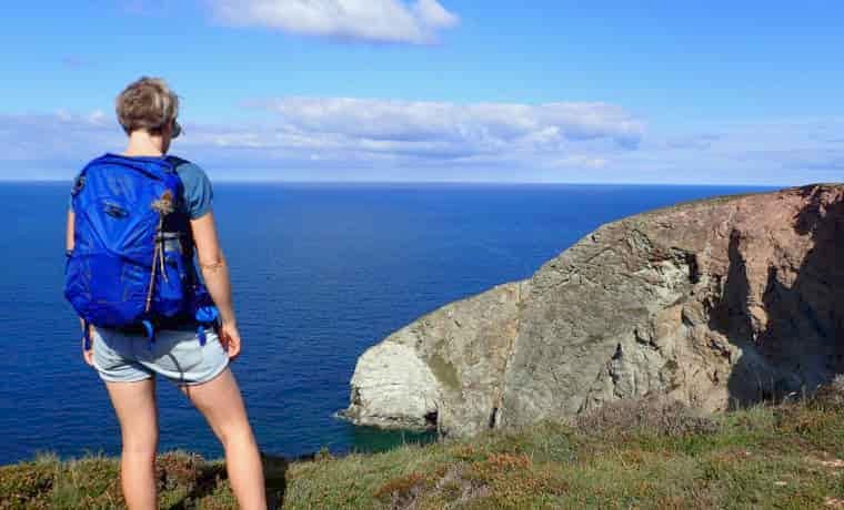 Woman standing on sea cliffs
