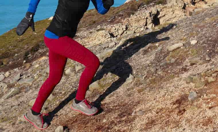 Red running leggings on female runner