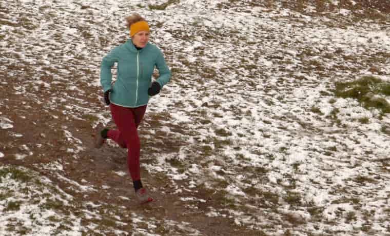 Woman running in the snow