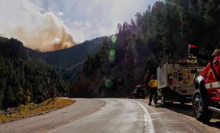 Fire fighters approaching mountain fire