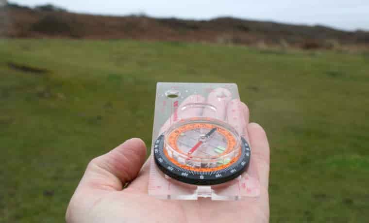 Compass in a persons hand