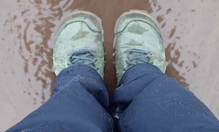 Hiking shoes in puddle