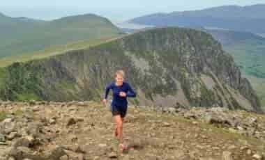 Woman-running-in-mountains
