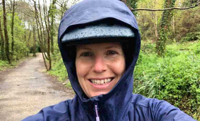 Woman with hood up in the rain