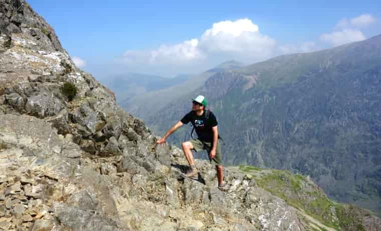 Man climbing a mountain