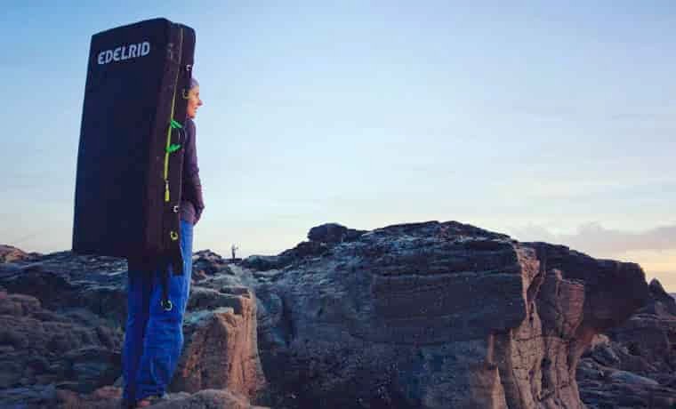 Woman carrying boulder mat