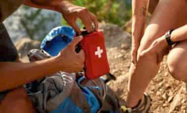 Person giving outdoor first aid