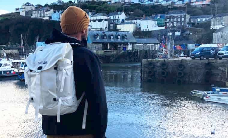 Man carrying pack in town