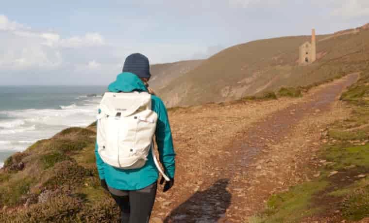 Woman hiking with Camelbak Adventure Travel Pack