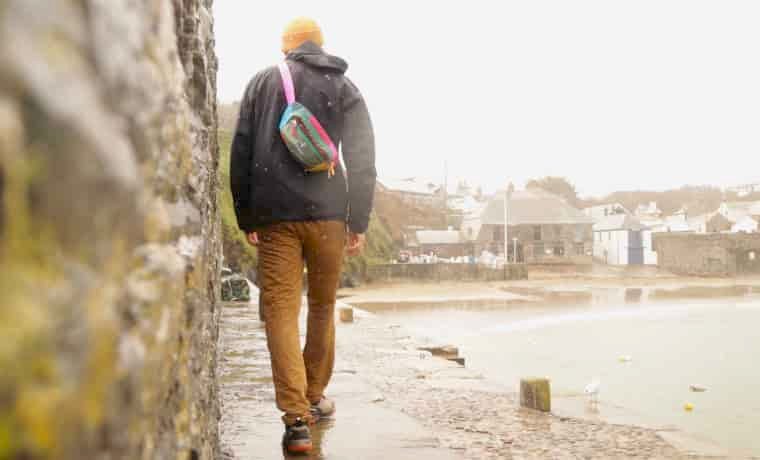 Man walking on harbour