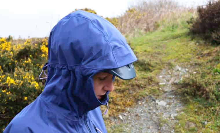 Woman with jacket hood up