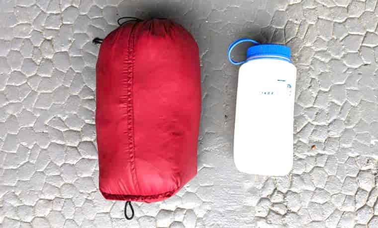 Packed jacket next to bottle