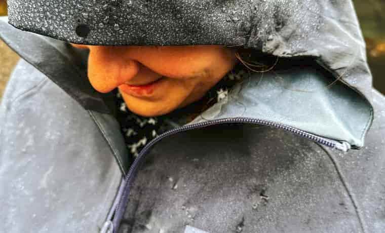 Woman with hood up in the rain