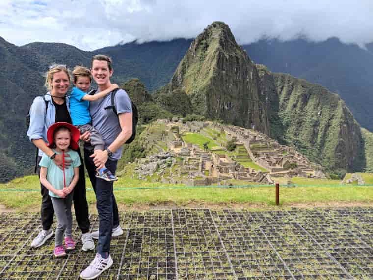 Family visiting ruins in mountains