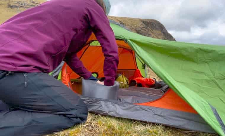 Inflating sleeping mat in tent