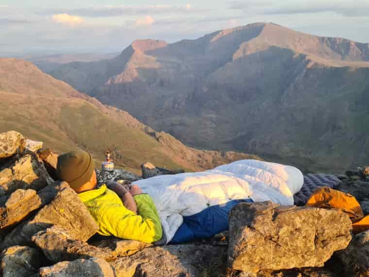 Man in quilt in mountains