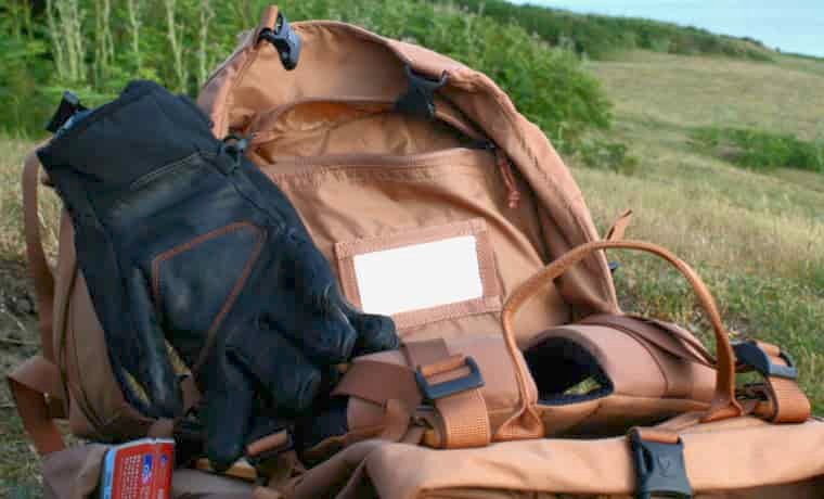 Backpack with gloves clipped on