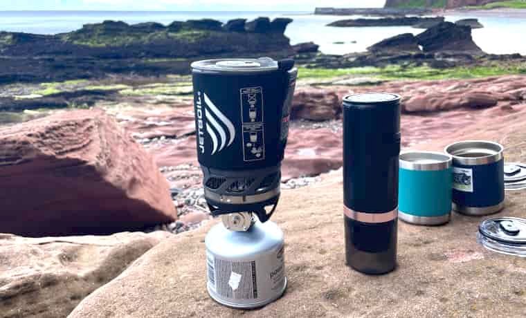 Jetboil and mugs near sea