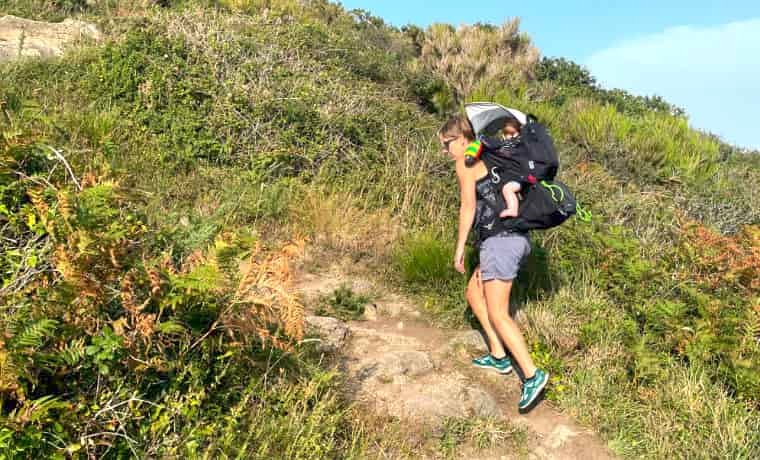 Woman Hiking with baby on back