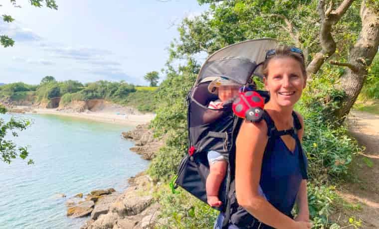 Woman by beach with baby