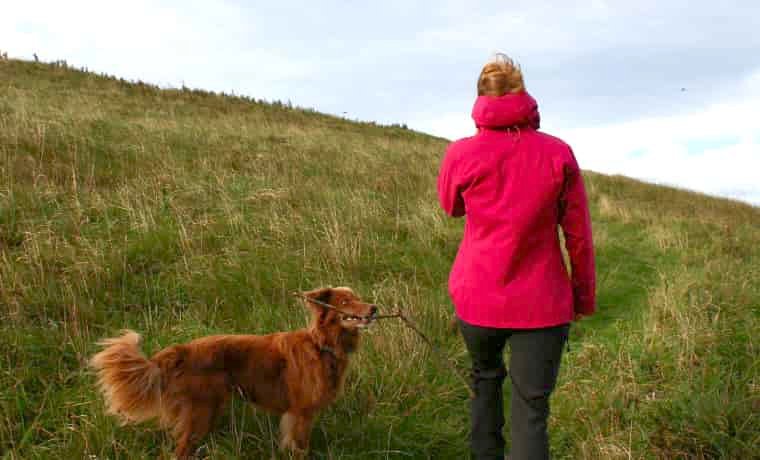 Woman walking dog