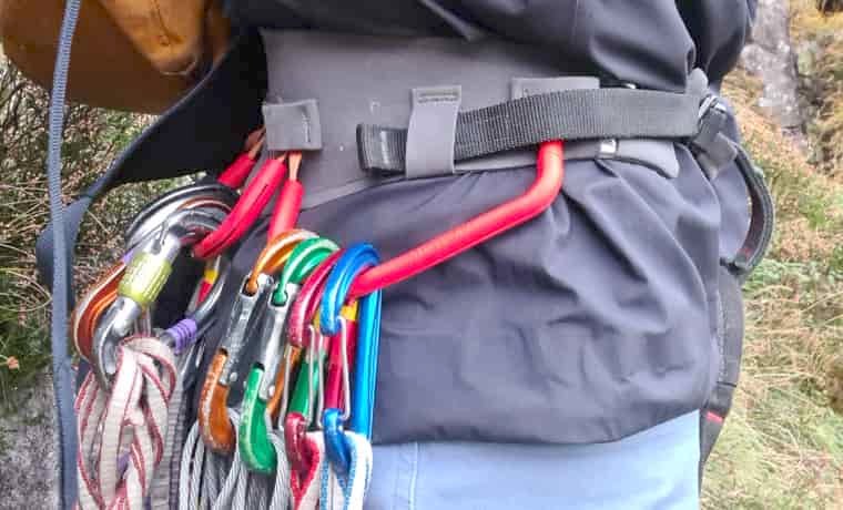 Jacket hem with climbing gear and harness