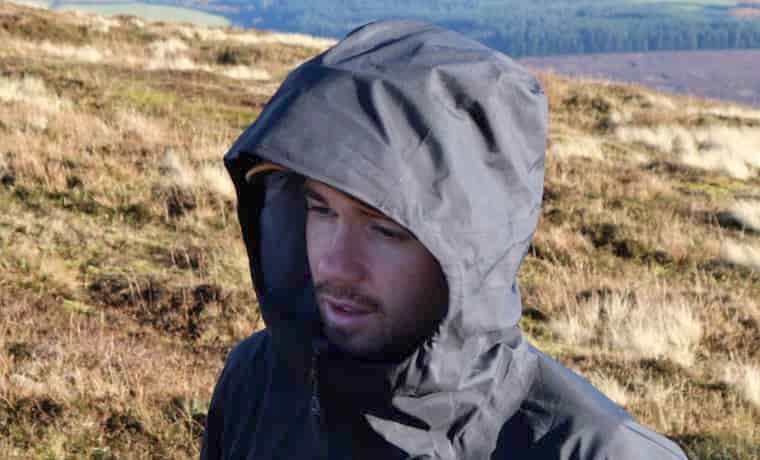 Man with jacket hood up
