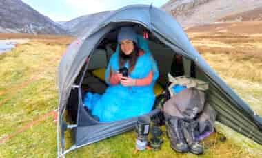 Woman in thermarest boost sleeping bag in tent