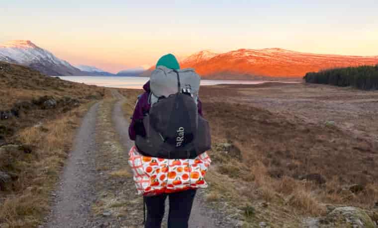 Hiking at sunset with Rab backpack