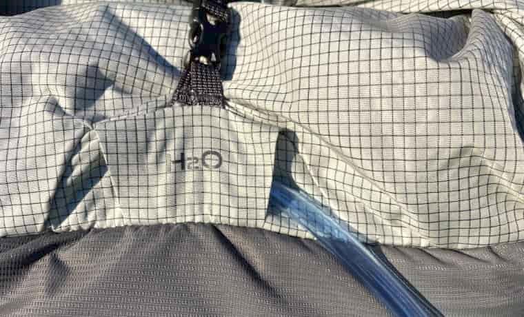 Hydration port on backpack