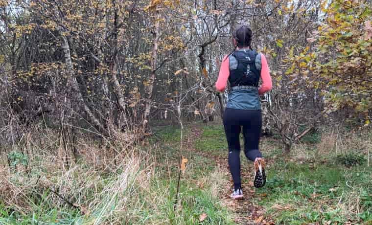 Woman running in the woods